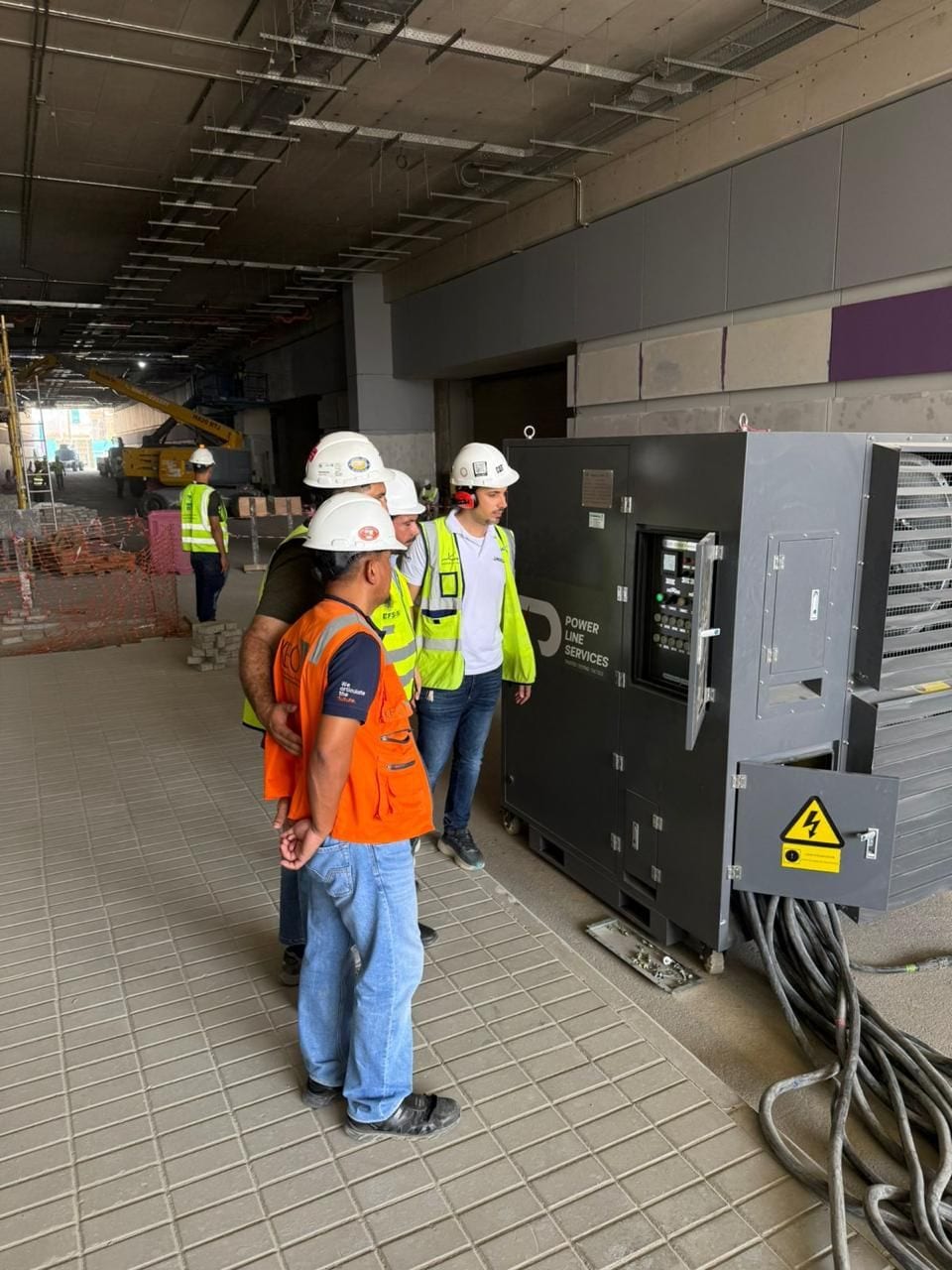 Crew inspecting a load bank on site