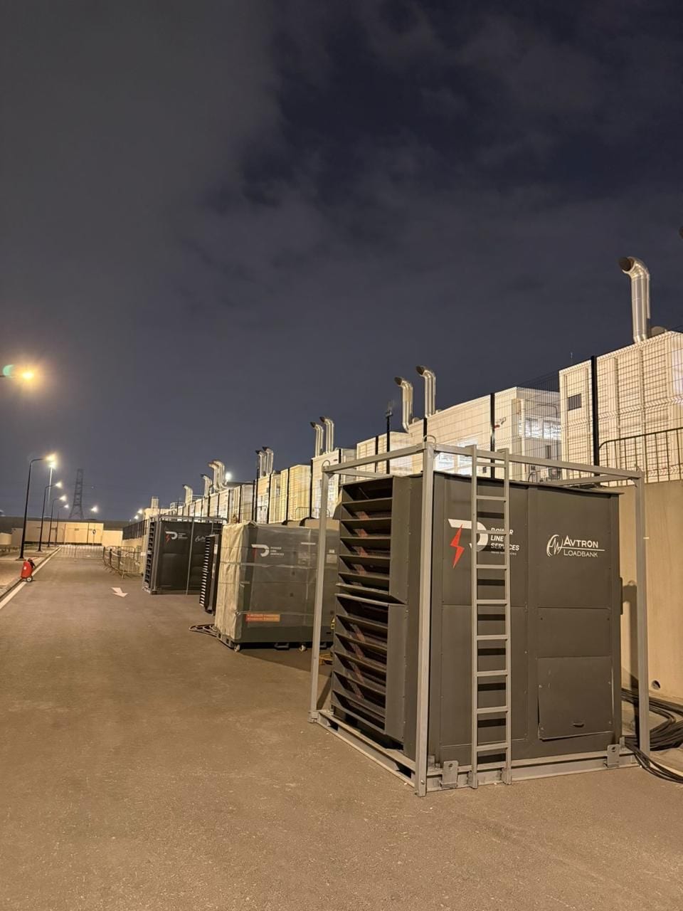 Load banks at a generator yard at dusk